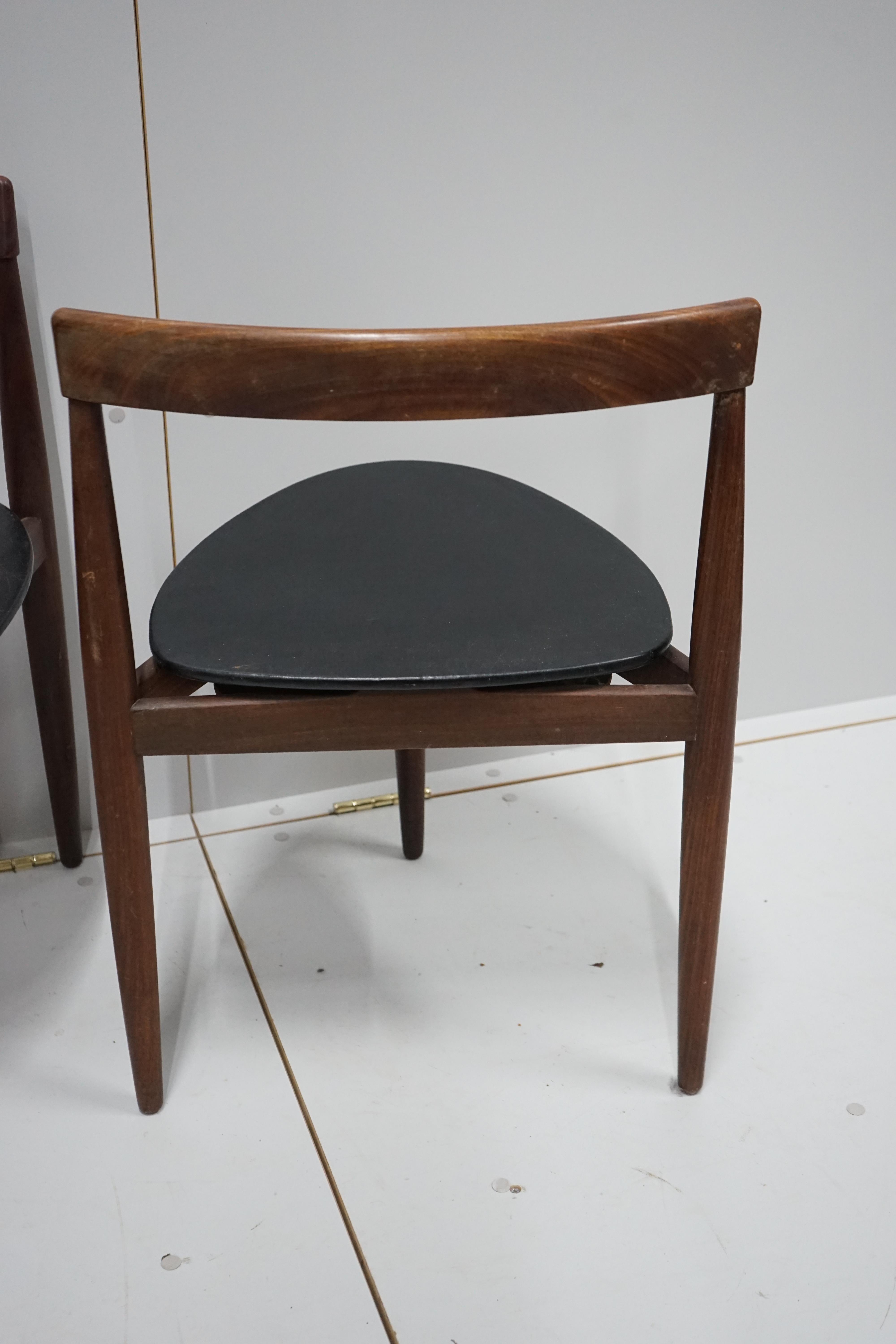 Hans Olsen for Frem Rotle, a set of four aphromosia tripod dining chairs, width 50cm, depth 41cm, height 71cm.